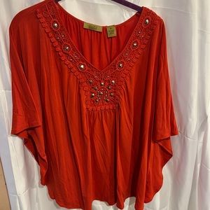Orange Valerie Stevens shirt